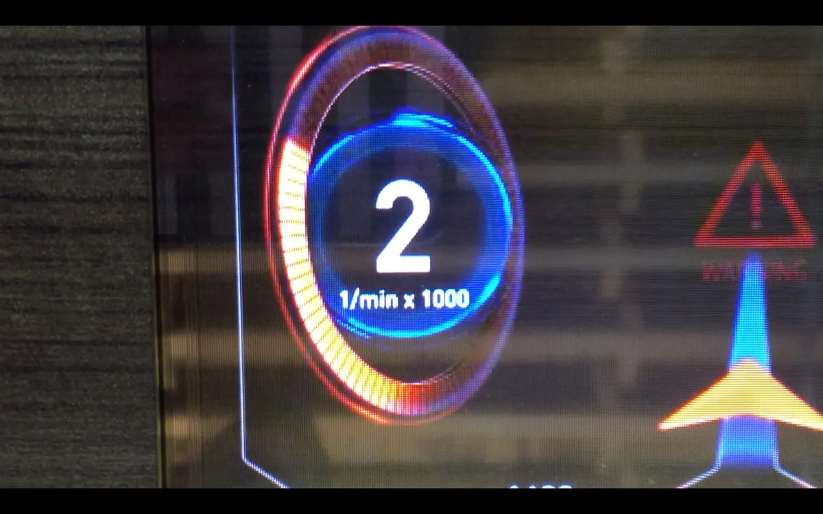 Early saturated test graphics glowing on the transparent OLED
