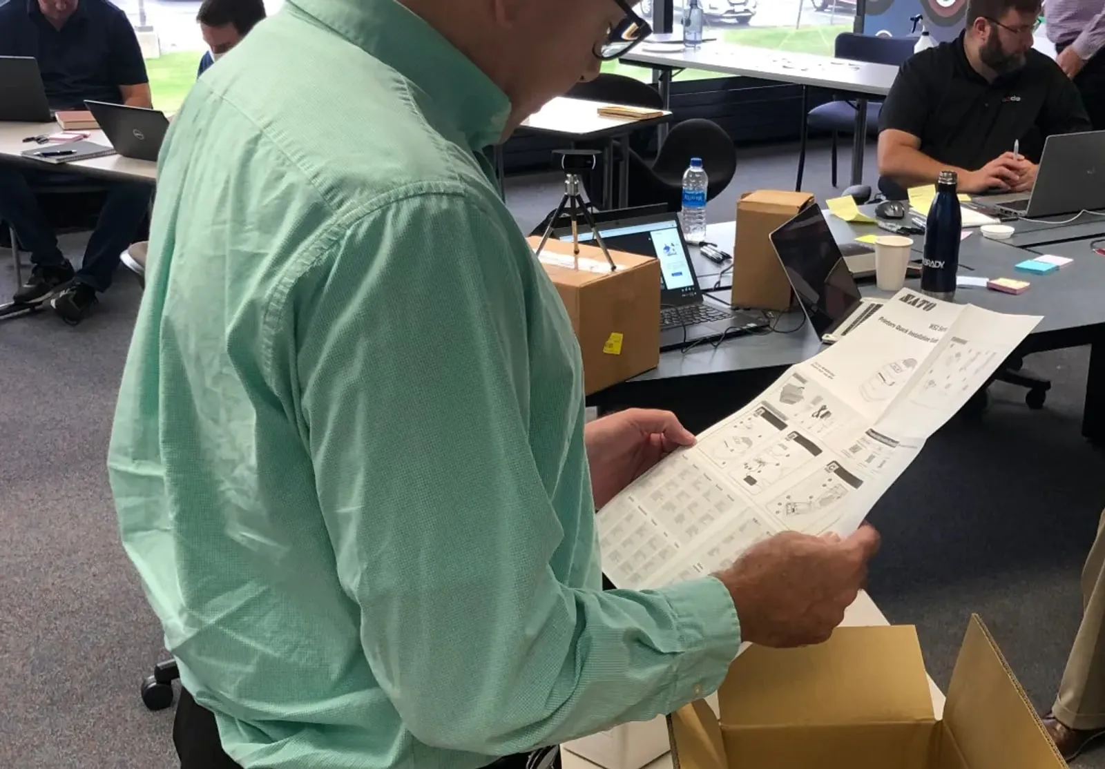 Healthcare printing workshop participants exploring a printer together